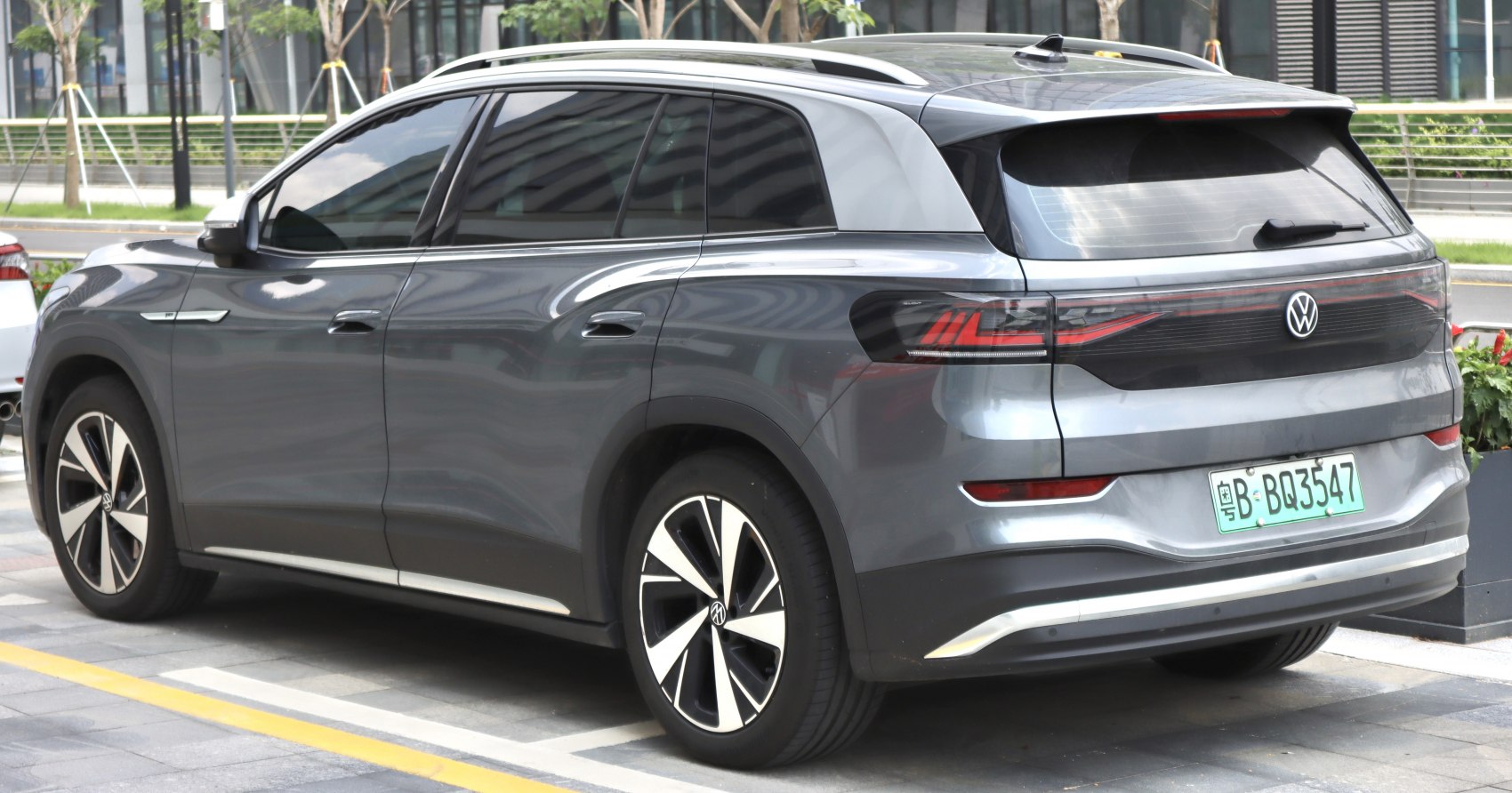Electric SUV rear side with sleek taillights and alloy wheels
