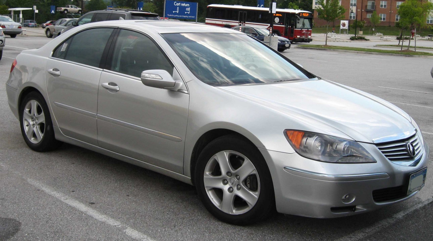 Silver luxury sedan with sleek body and alloy wheels.