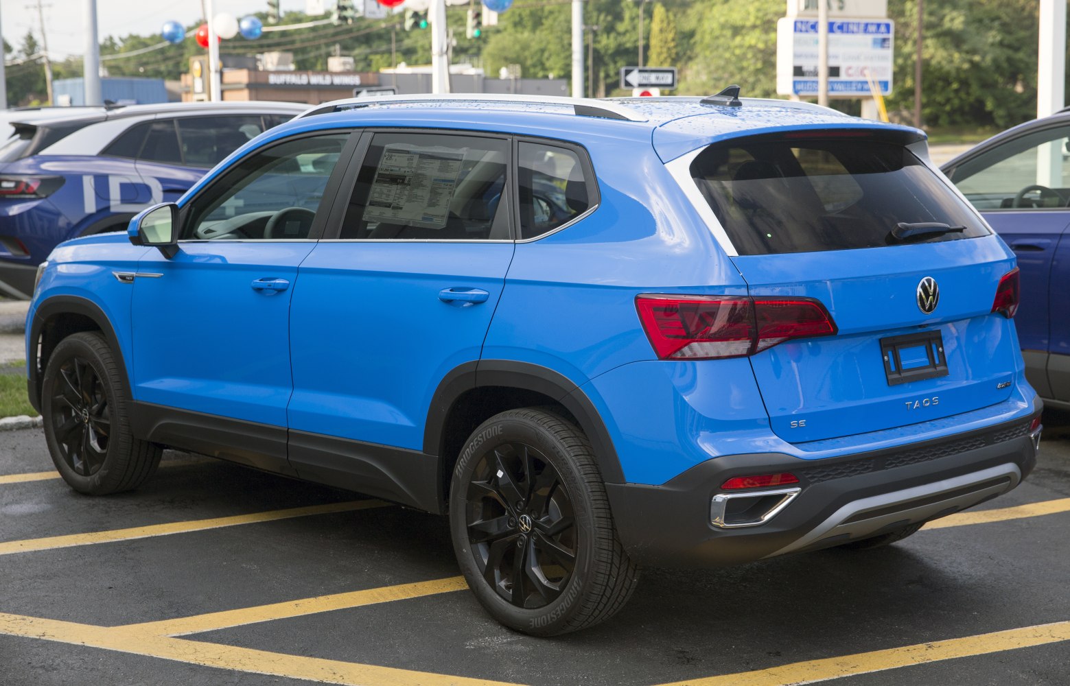 Blue compact SUV rear profile with black alloy wheels