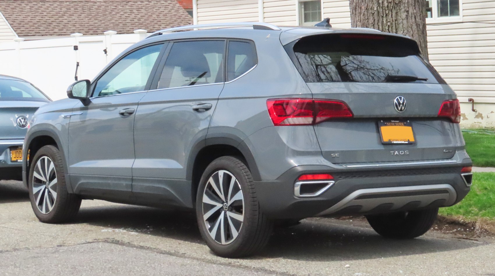 Rear side profile with taillights and alloy wheels