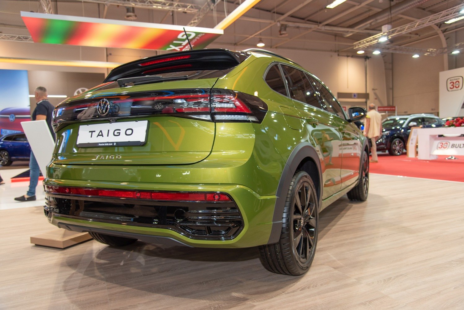 Rear view with LED tail lights and sporty green exterior