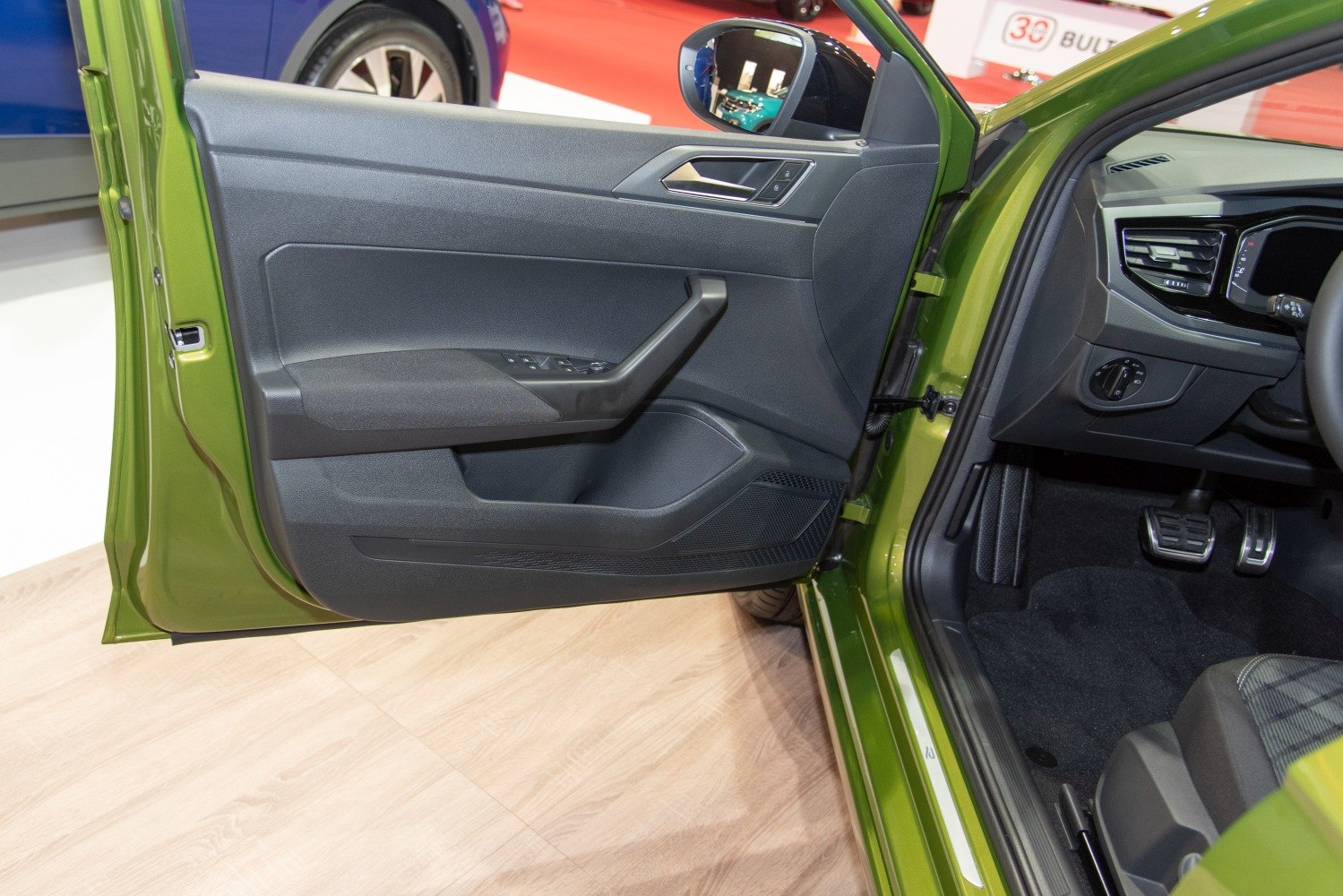 Interior door panel with controls and side mirror view