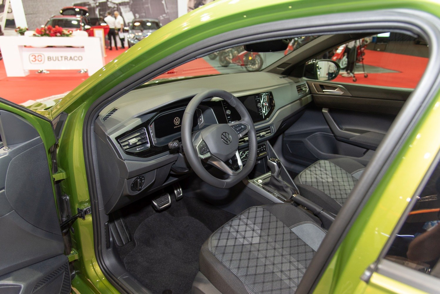 Modern dashboard and digital instrument cluster with patterned seats