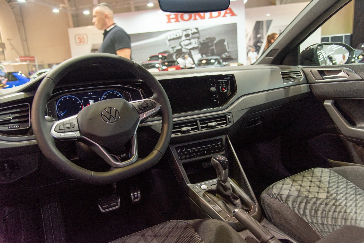 Modern car interior dashboard with digital instruments and touchscreen controls