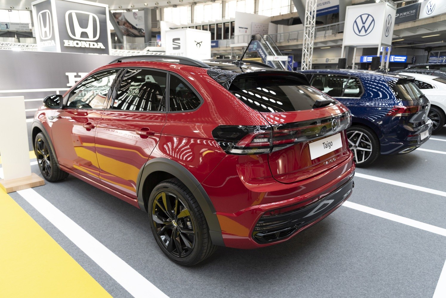 Rear side view of a modern crossover SUV with black alloy wheels
