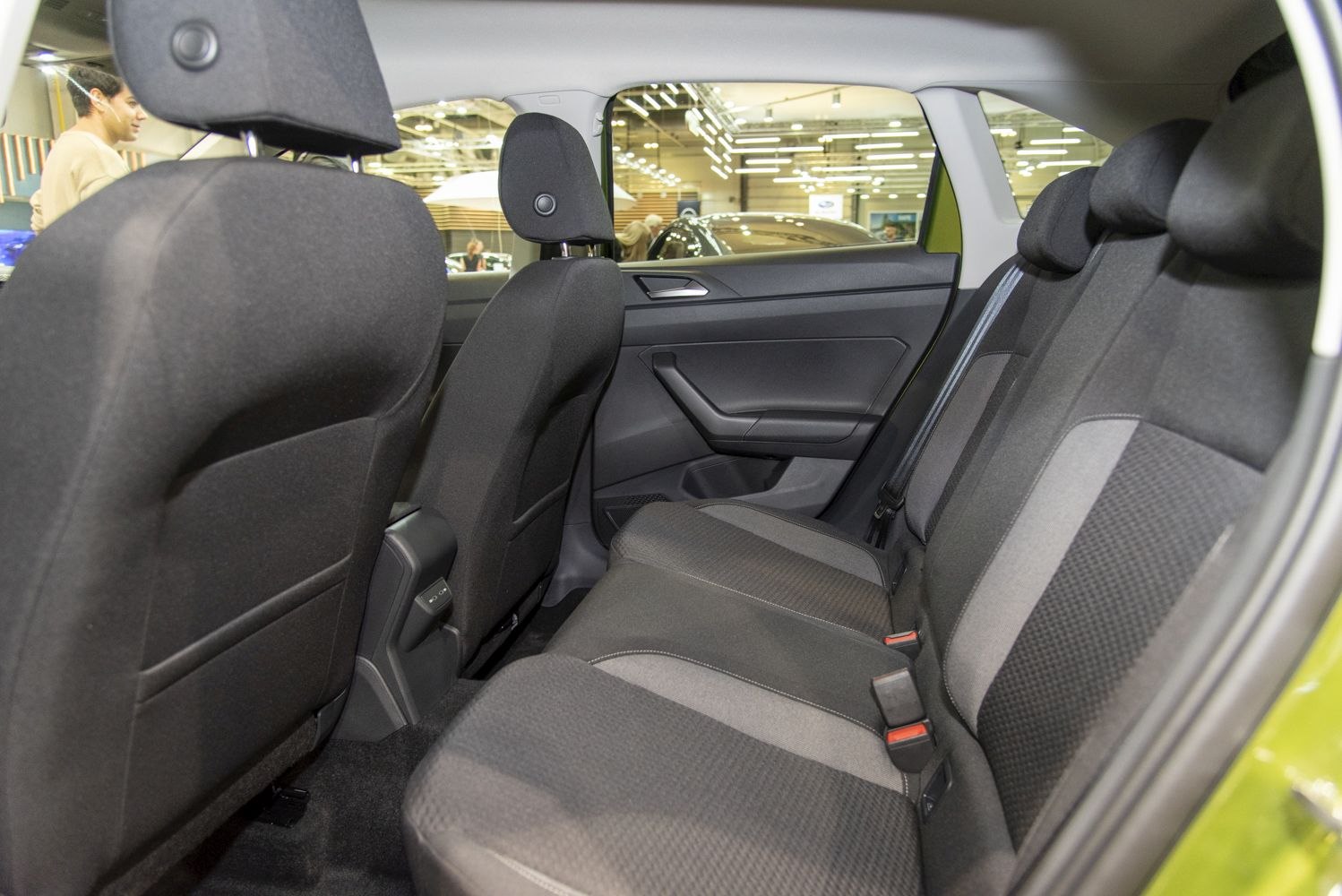 Rear passenger seat interior with fabric upholstery and ergonomic design