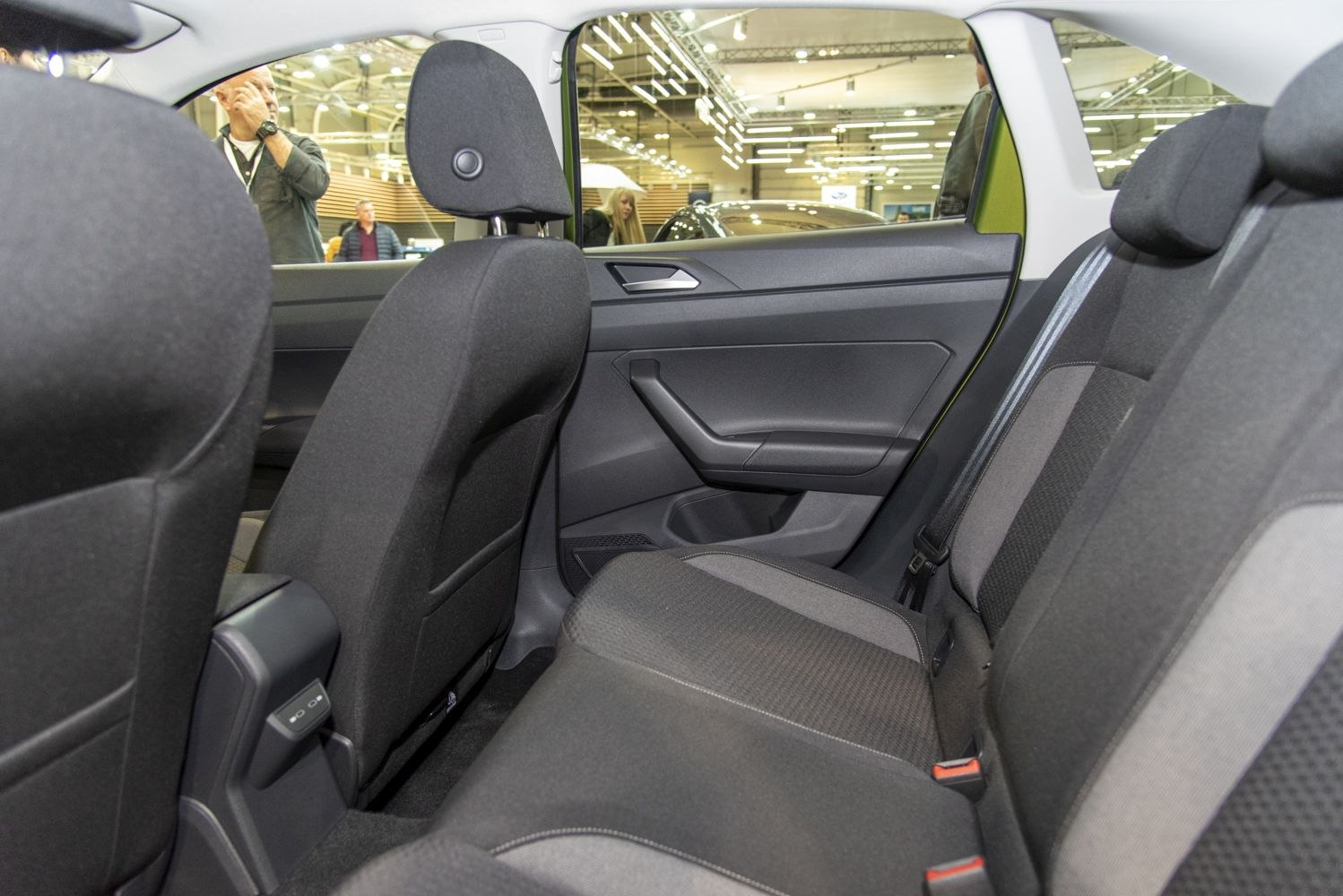 Spacious rear interior with fabric seats and modern door panel