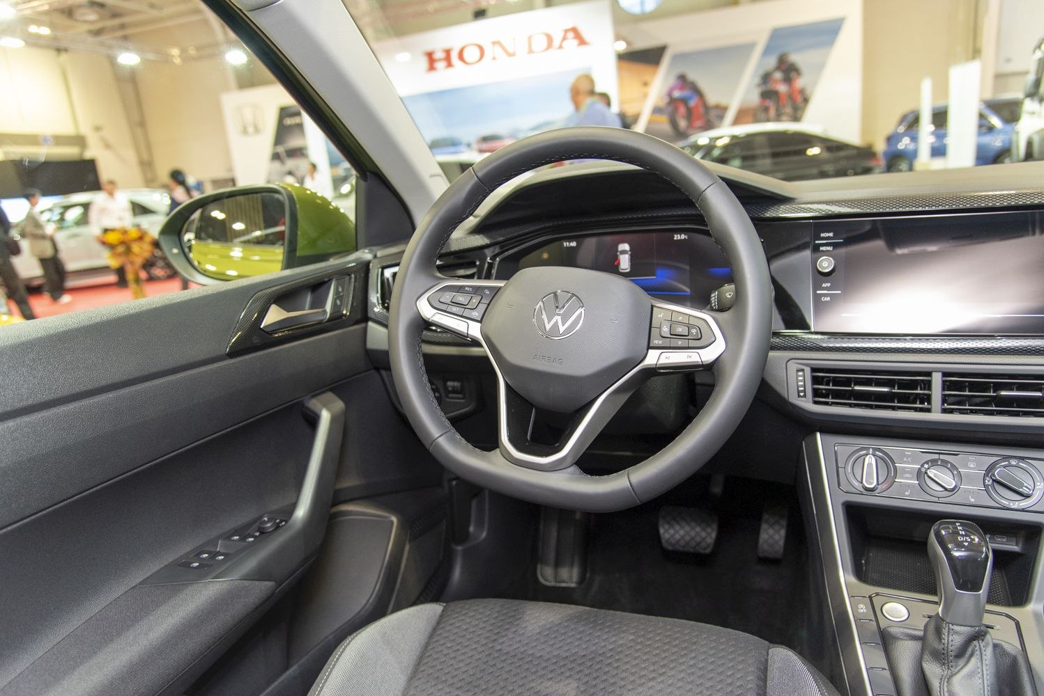 Steering wheel and digital dashboard inside modern car interior