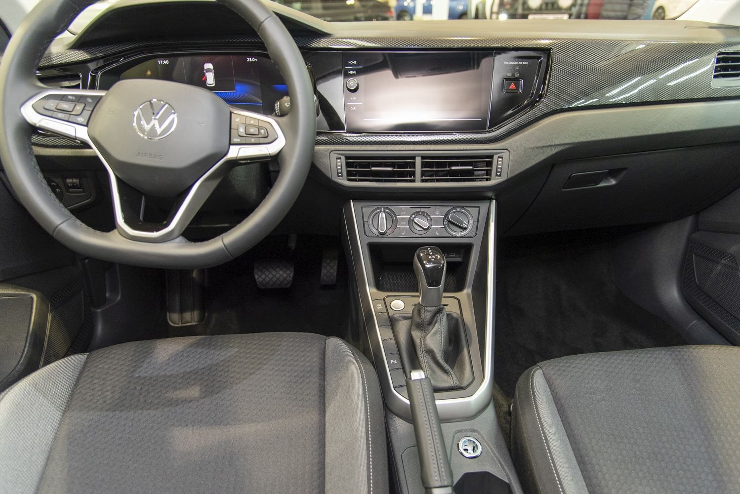 Digital dashboard and infotainment with gear shift in modern car interior
