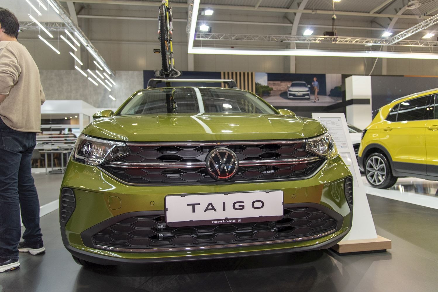 Green car front with hexagonal grille and VW emblem