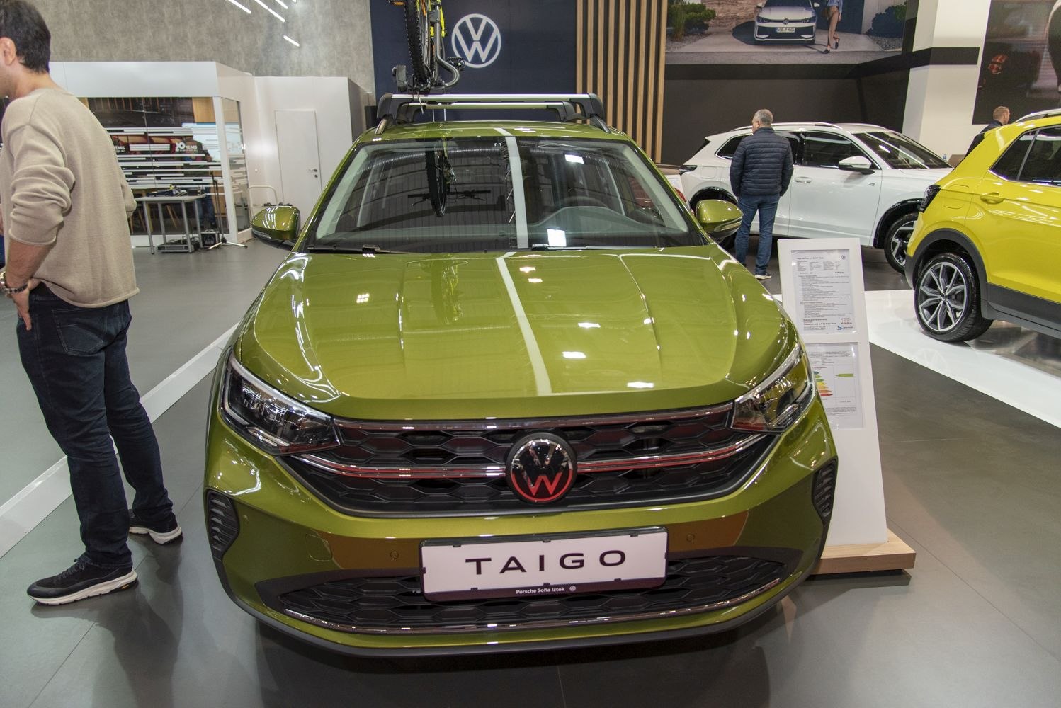 Front view of green vehicle with grille and roof rack