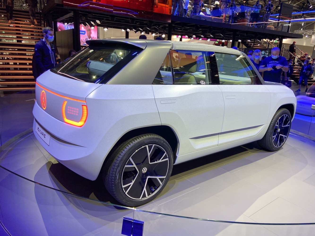 Rear side view of electric concept with illuminated taillights and modern wheels