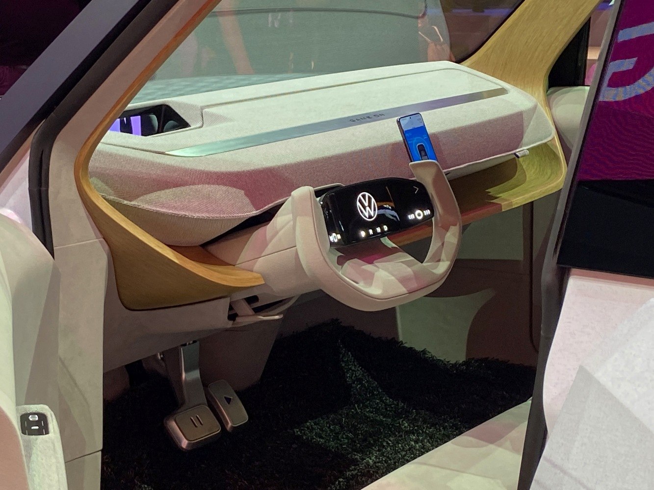 Digital steering wheel and modern dashboard with wood accents