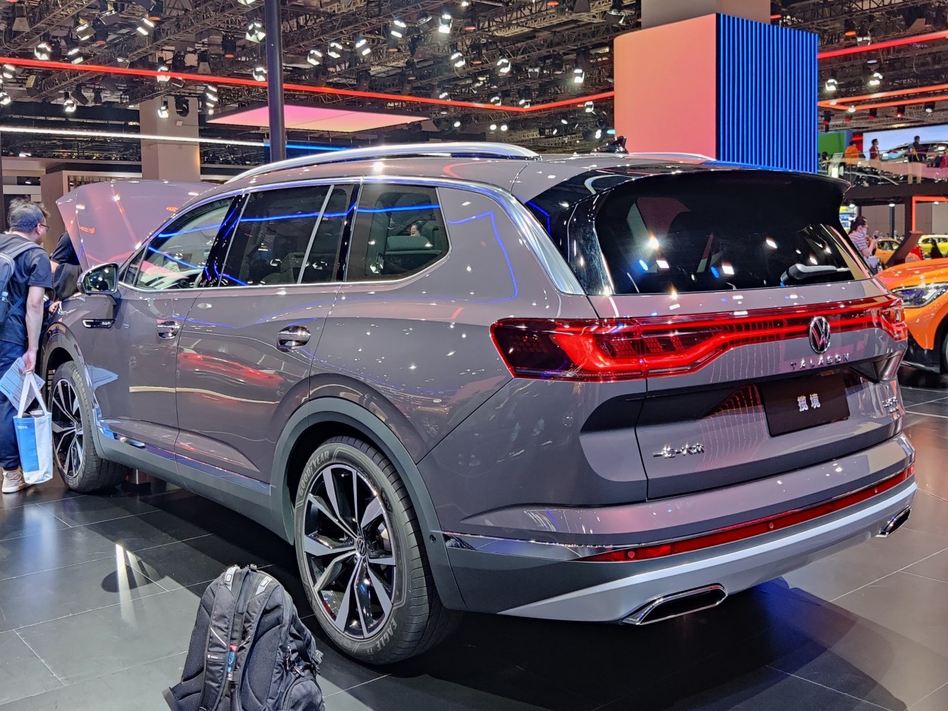 Sleek SUV rear and side profile with illuminated taillights and alloy wheels
