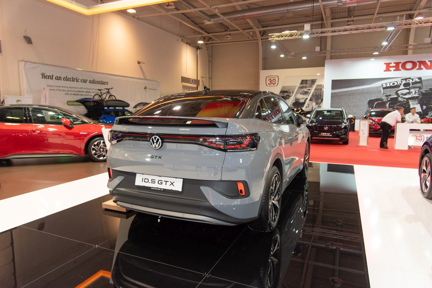 Sleek rear view and LED taillights of an electric SUV coupe