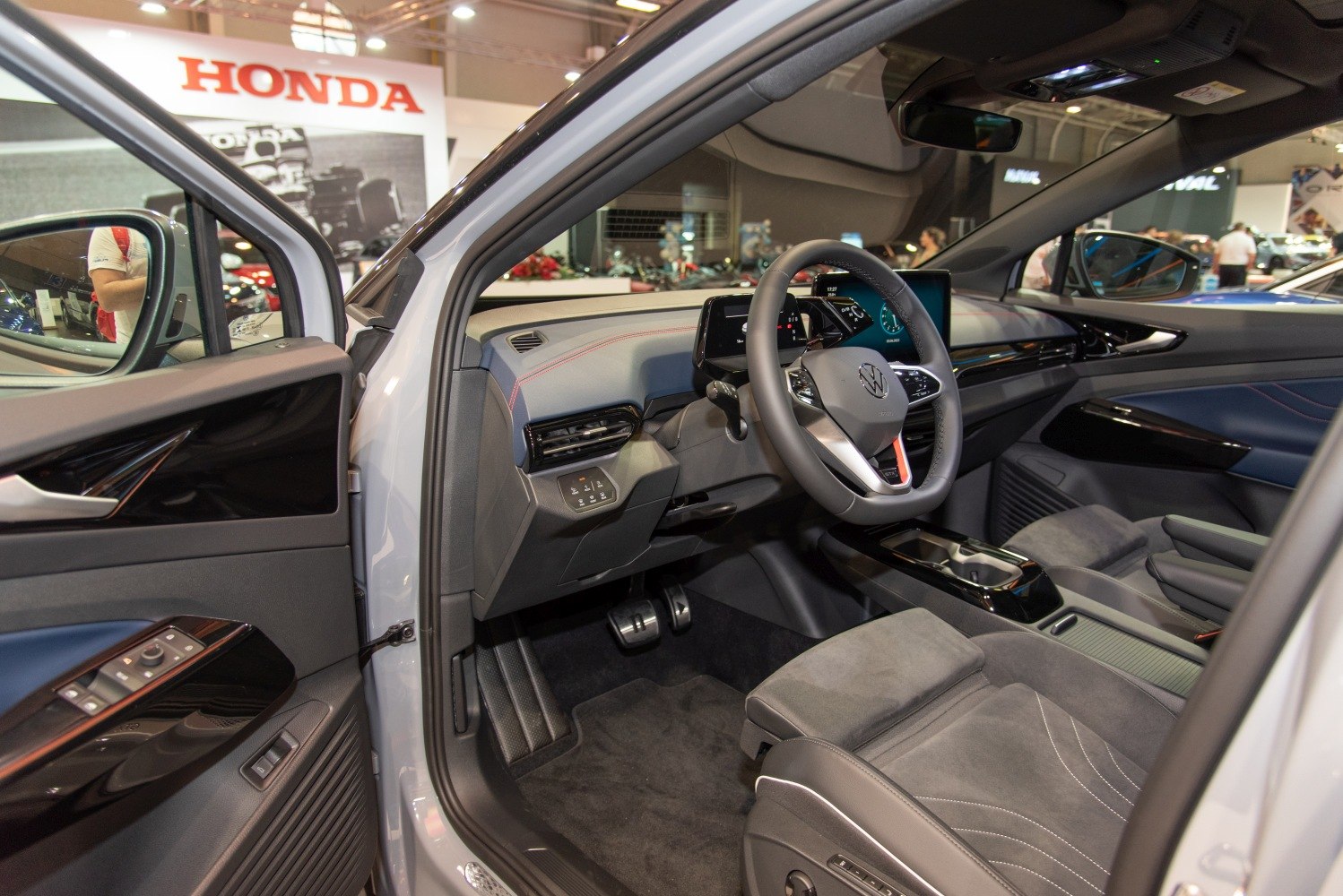 Digital dashboard and modern steering wheel in car interior