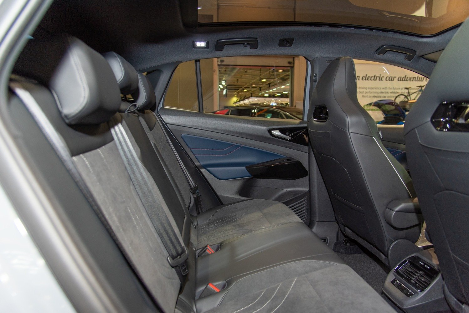 Rear seats and interior door panel in modern electric SUV