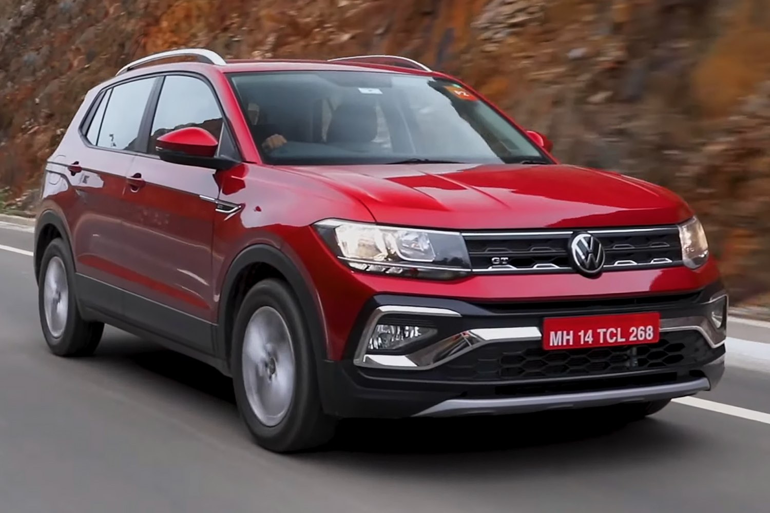 Front view of red SUV with GT badge and LED headlights