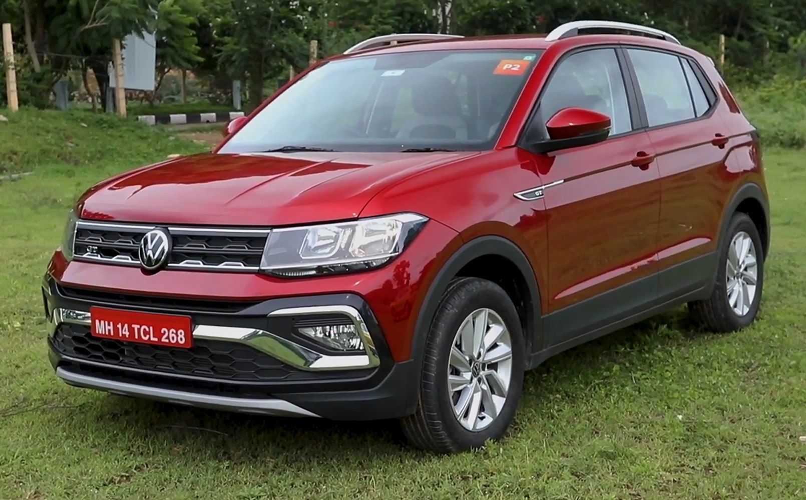 Front and side view with grille, headlights, and alloy wheels