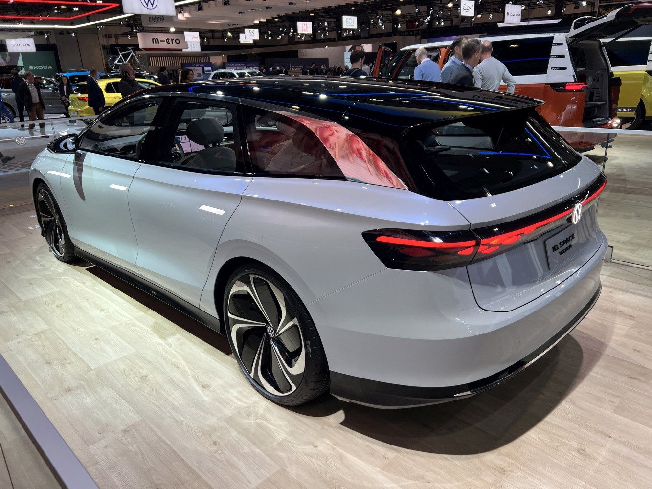 Sleek rear and side view of futuristic concept wagon with aerodynamic design and distinctive lighting.