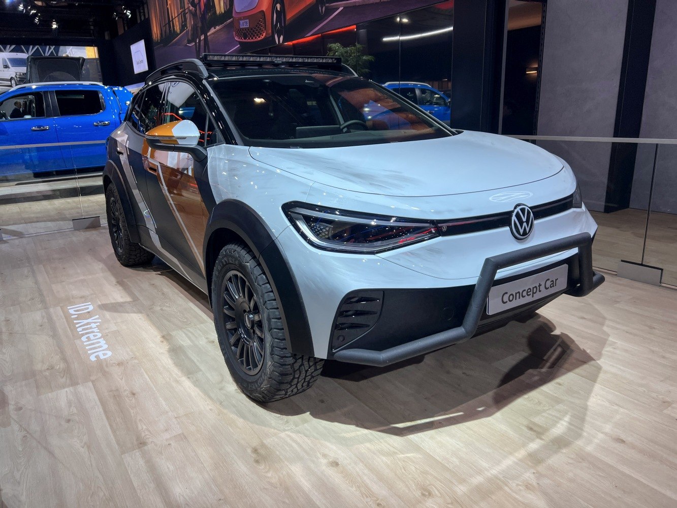 Rugged front bumper and off-road tires on electric SUV concept