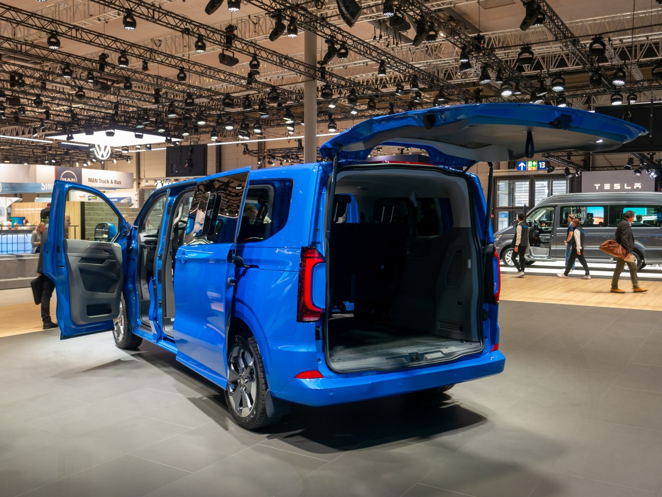 Open rear hatch and sliding side doors showing spacious van interior