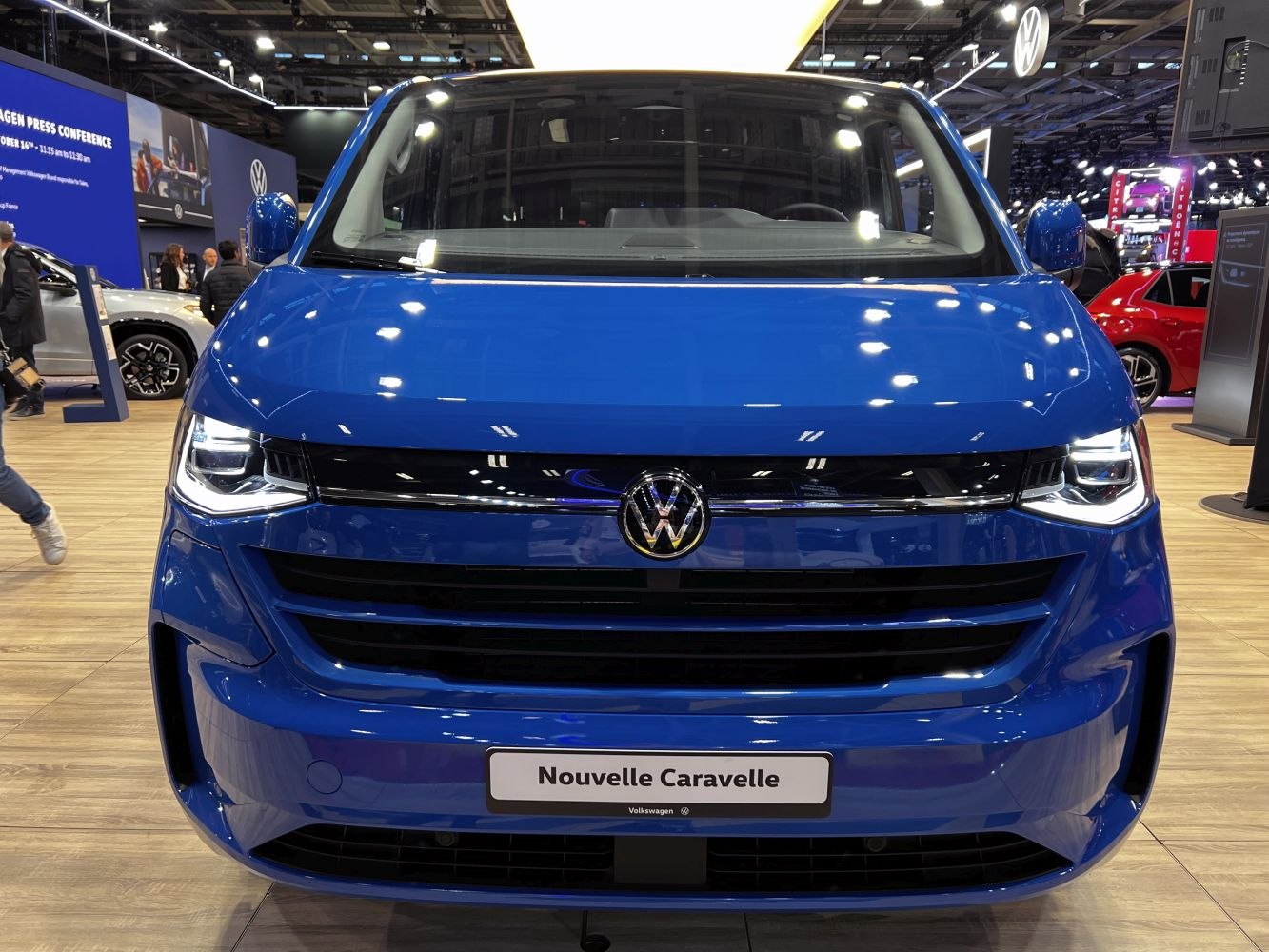 Front view of a blue van with LED headlights and Volkswagen logo