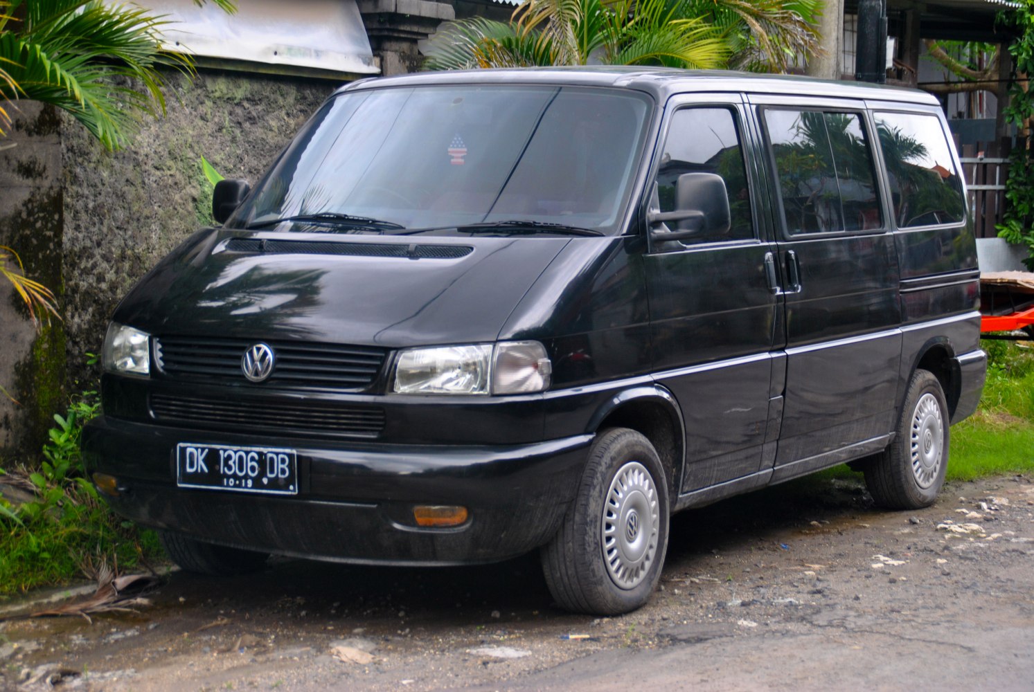 Black Volkswagen van front side view with sliding door