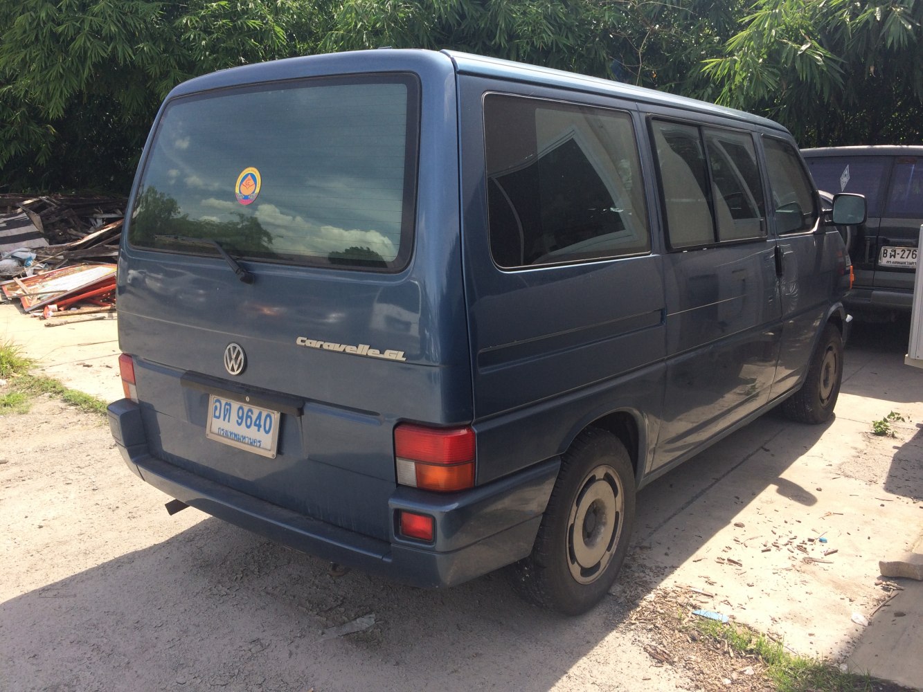 Rear view of boxy van with rear window wiper and classic design