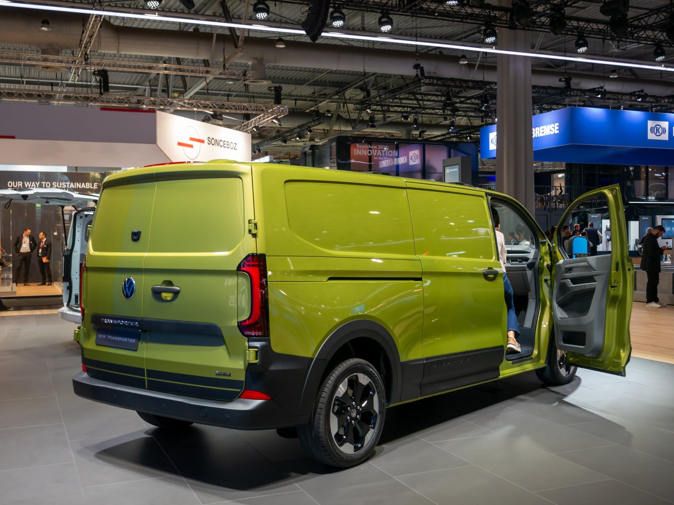 Rear and side view of a panel van with open driver door