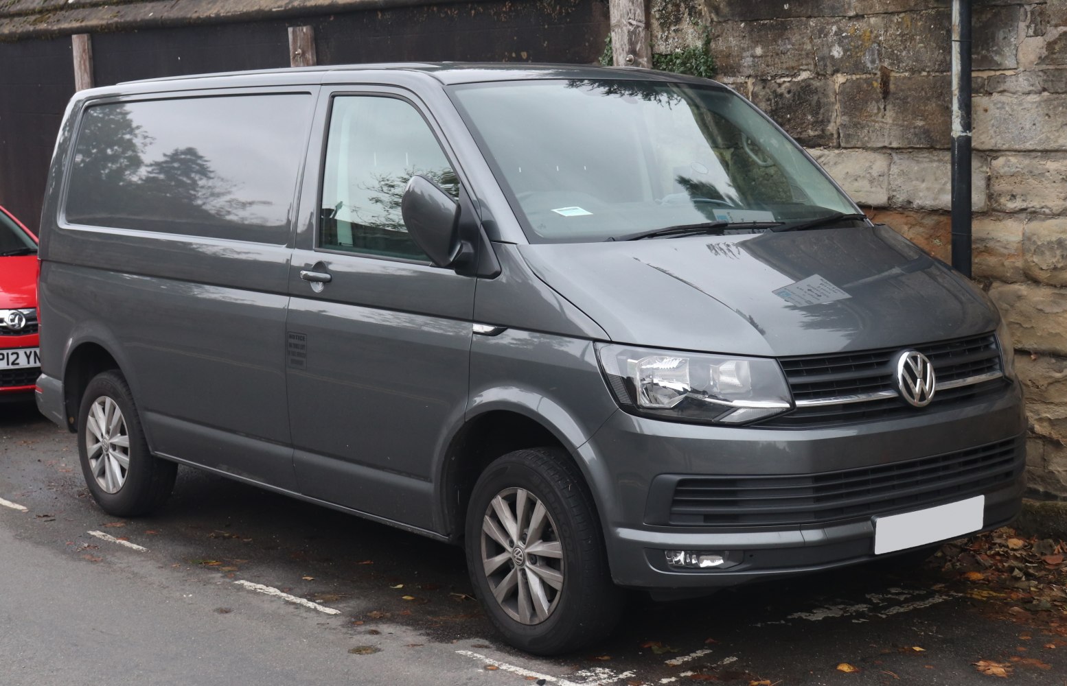 front and side view of grey panel van with alloy wheels