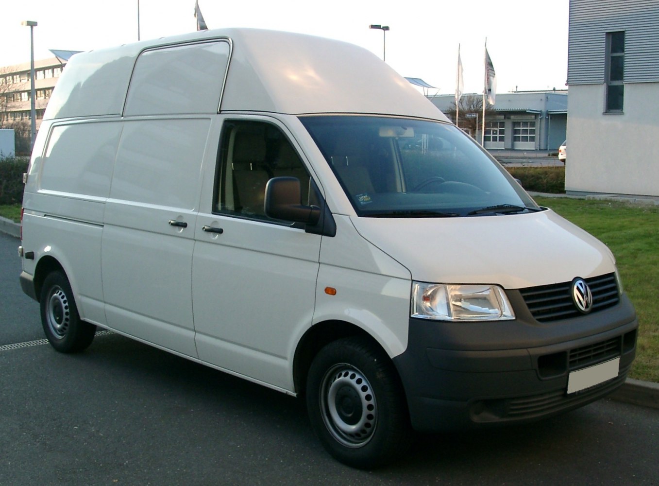 White high-top panel van with sliding side door and steel wheels