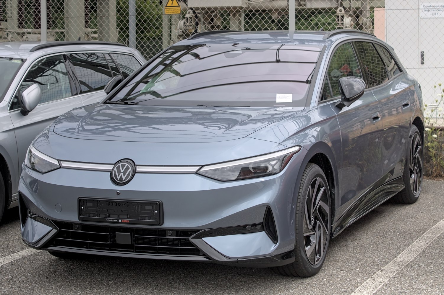 Front view of modern electric wagon with aerodynamic headlights and smooth lines