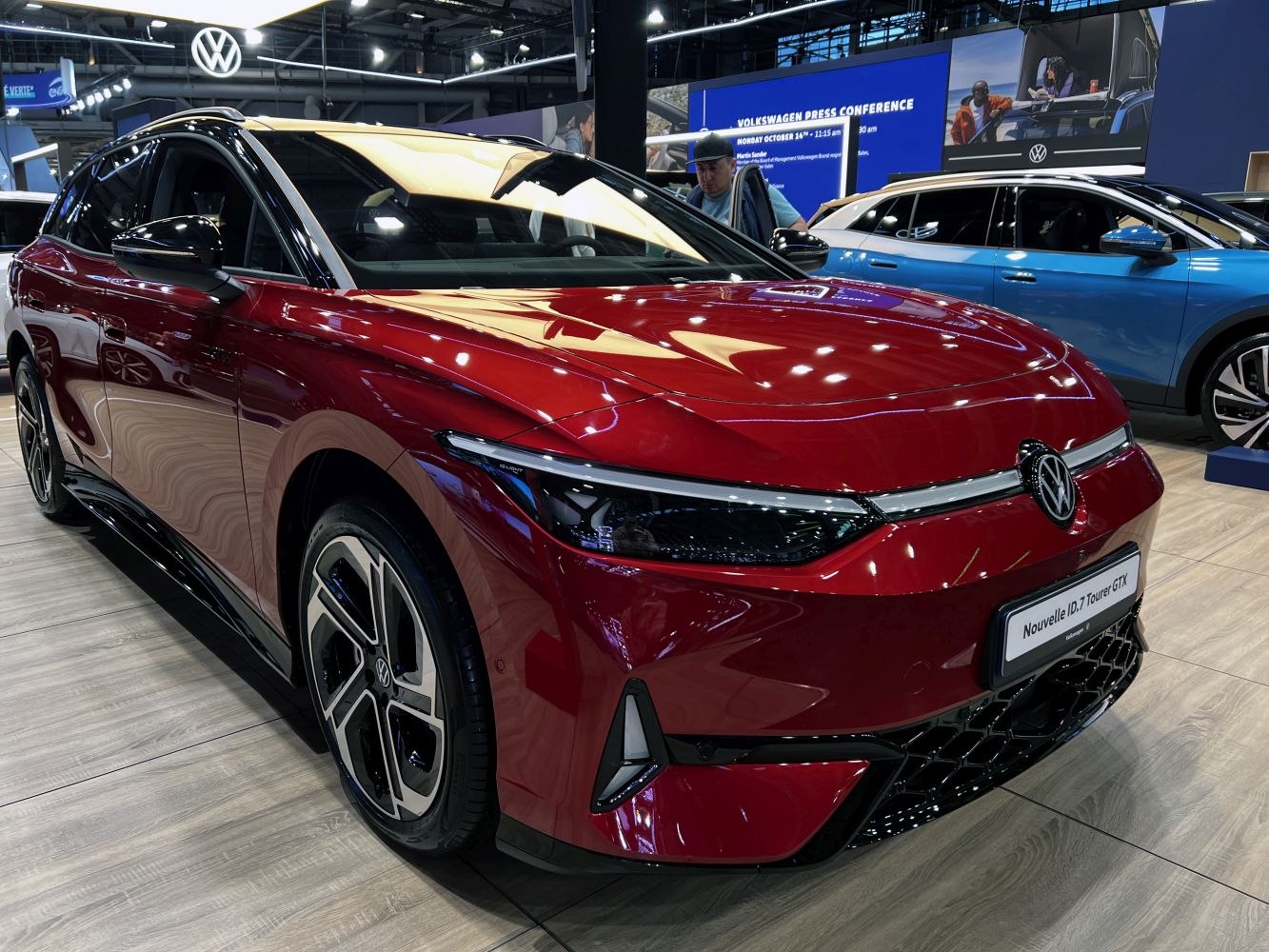 Red electric vehicle with sleek front and advanced LED headlights