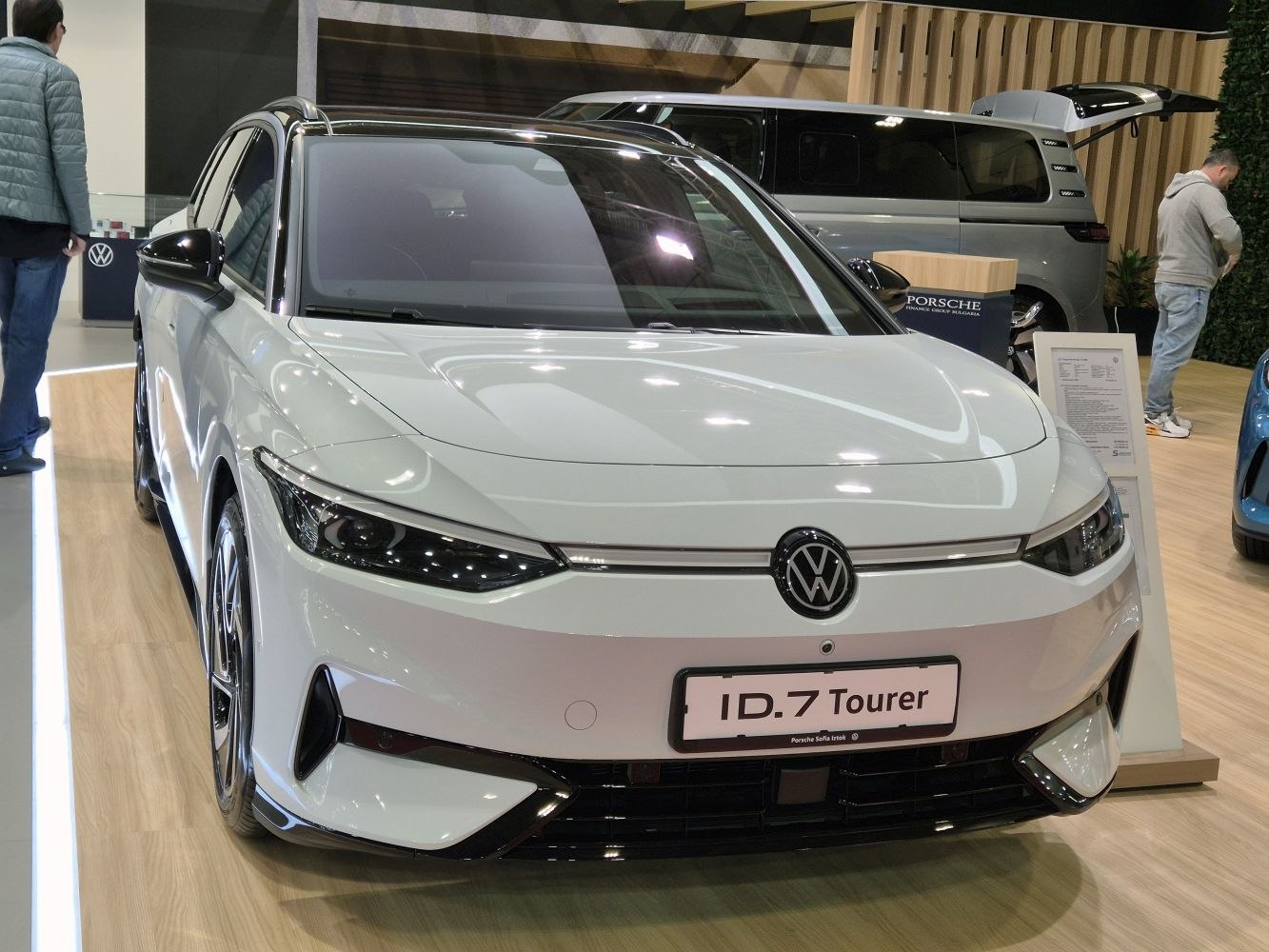 Front view of a modern electric touring vehicle with sleek LED headlights
