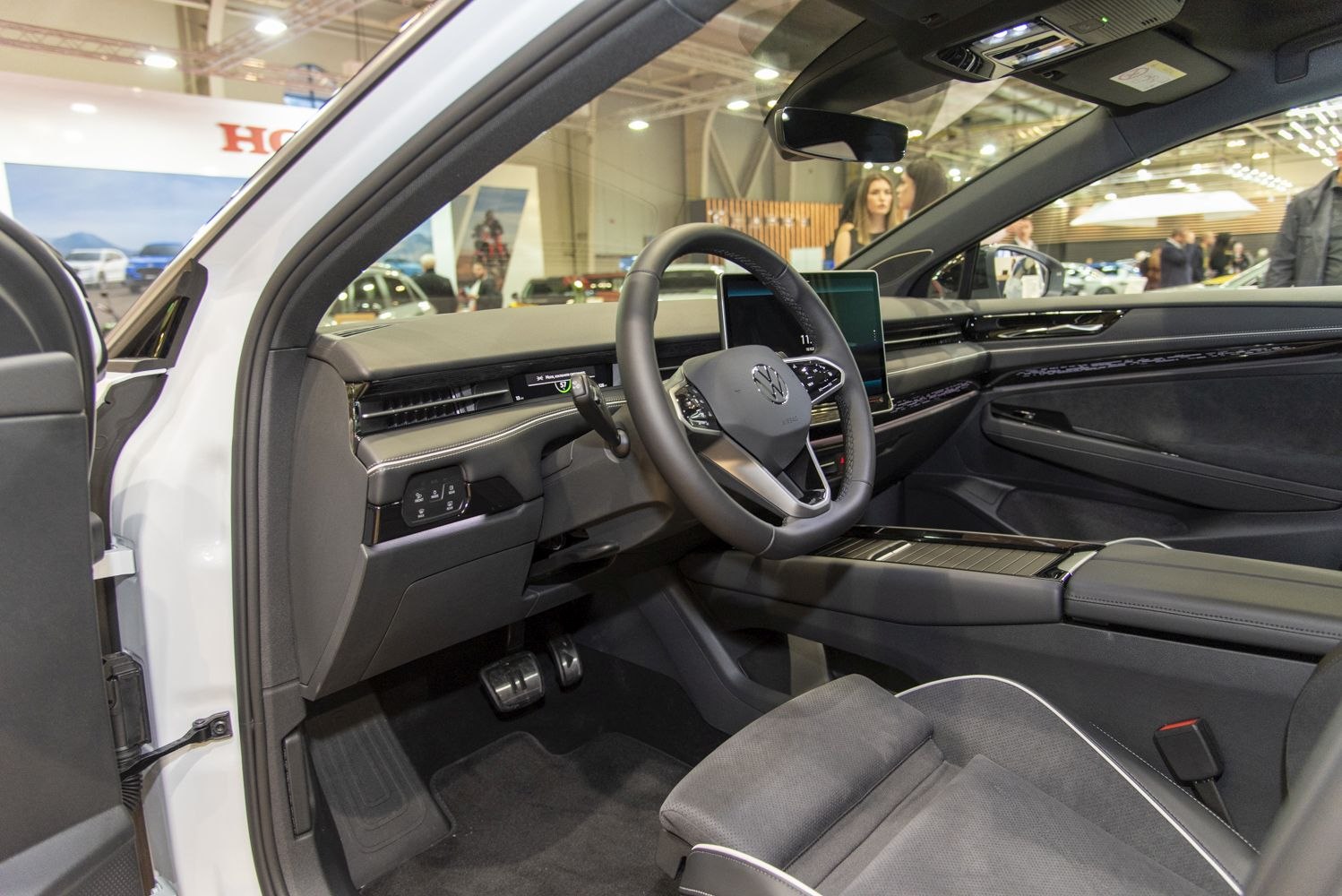 Digital dashboard and modern steering wheel in a car interior