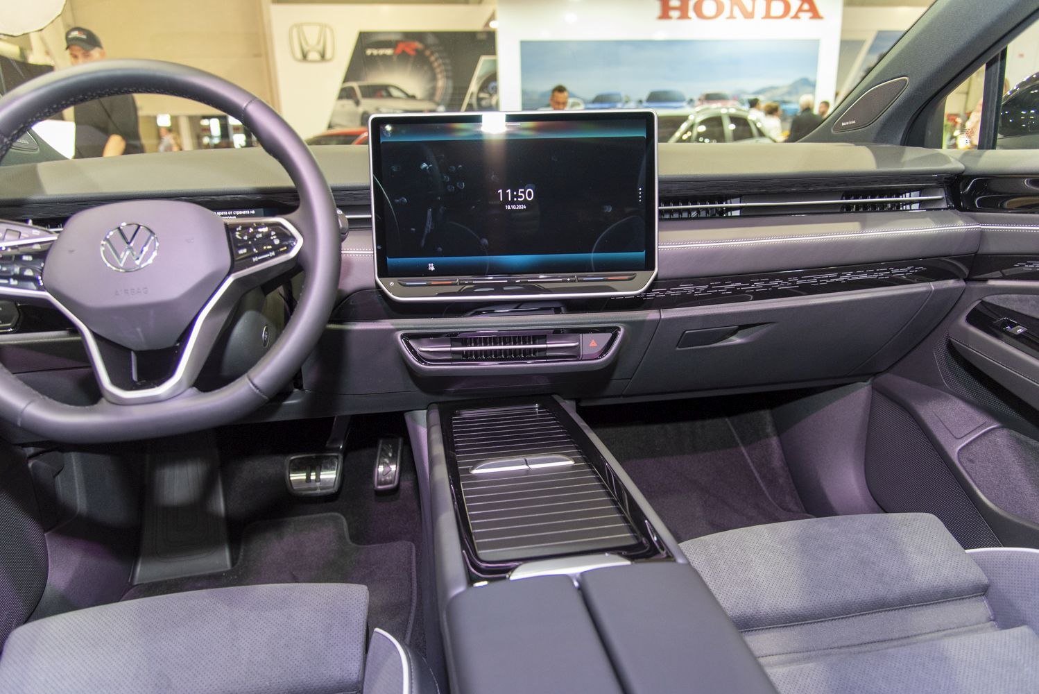 Digital cockpit and large central touchscreen display inside modern car interior