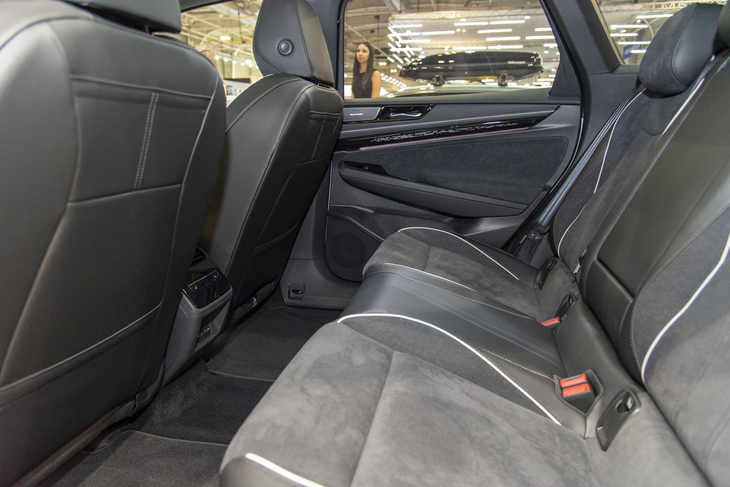 Modern spacious rear interior with premium black upholstery and seating detail