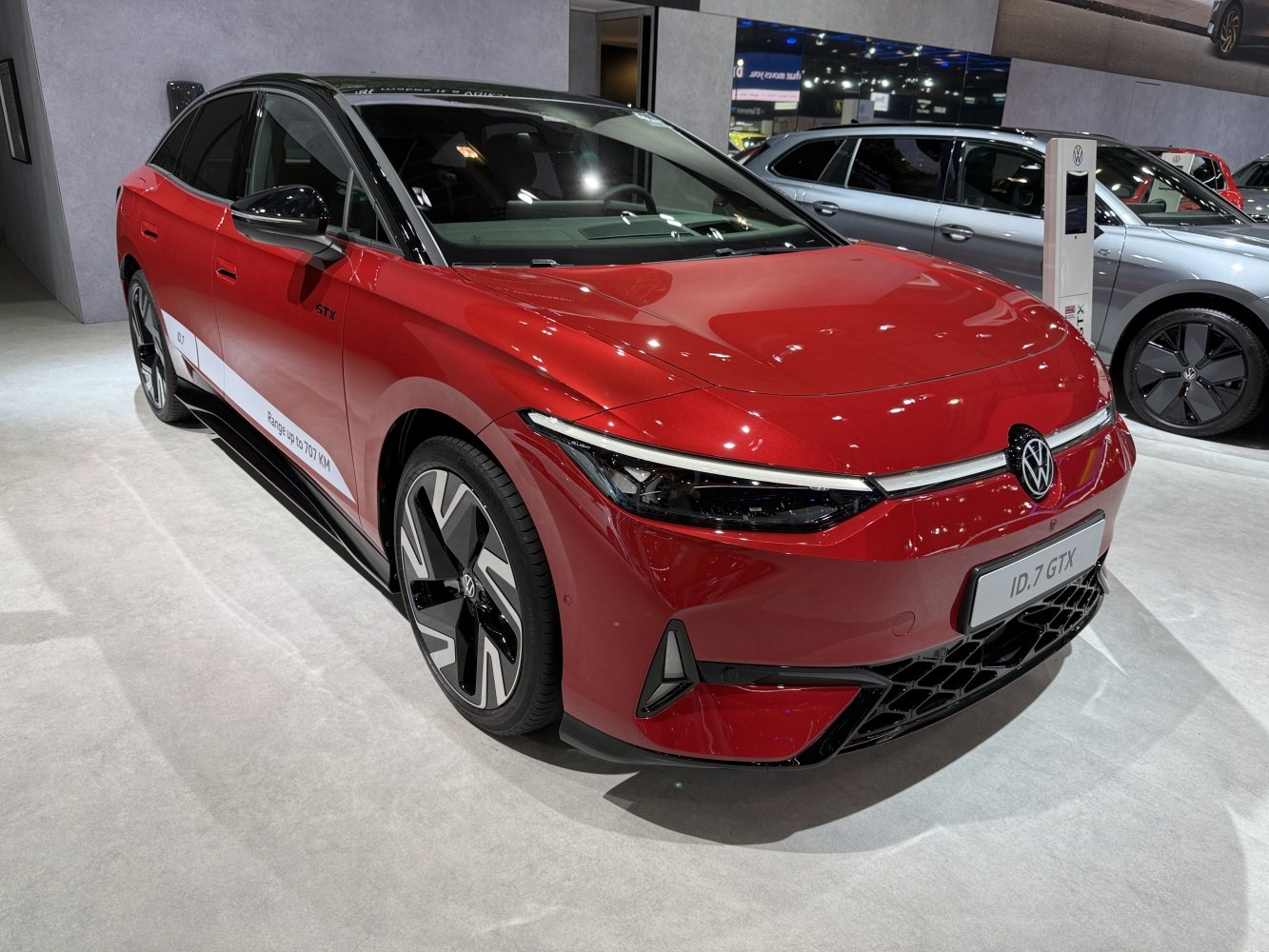 Front view of a sleek electric sedan with modern LED headlights and sporty aerodynamic design.