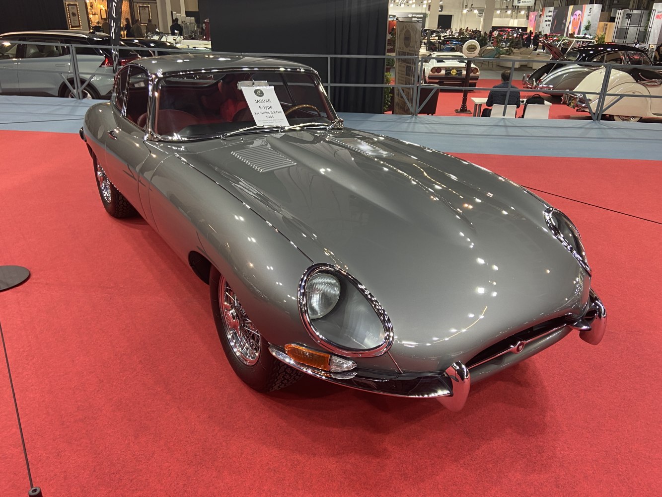 Classic vintage car with smooth curved body and chrome bumpers