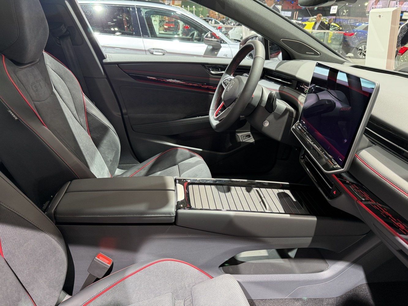 Sport seats with red accents and digital dashboard touchscreen