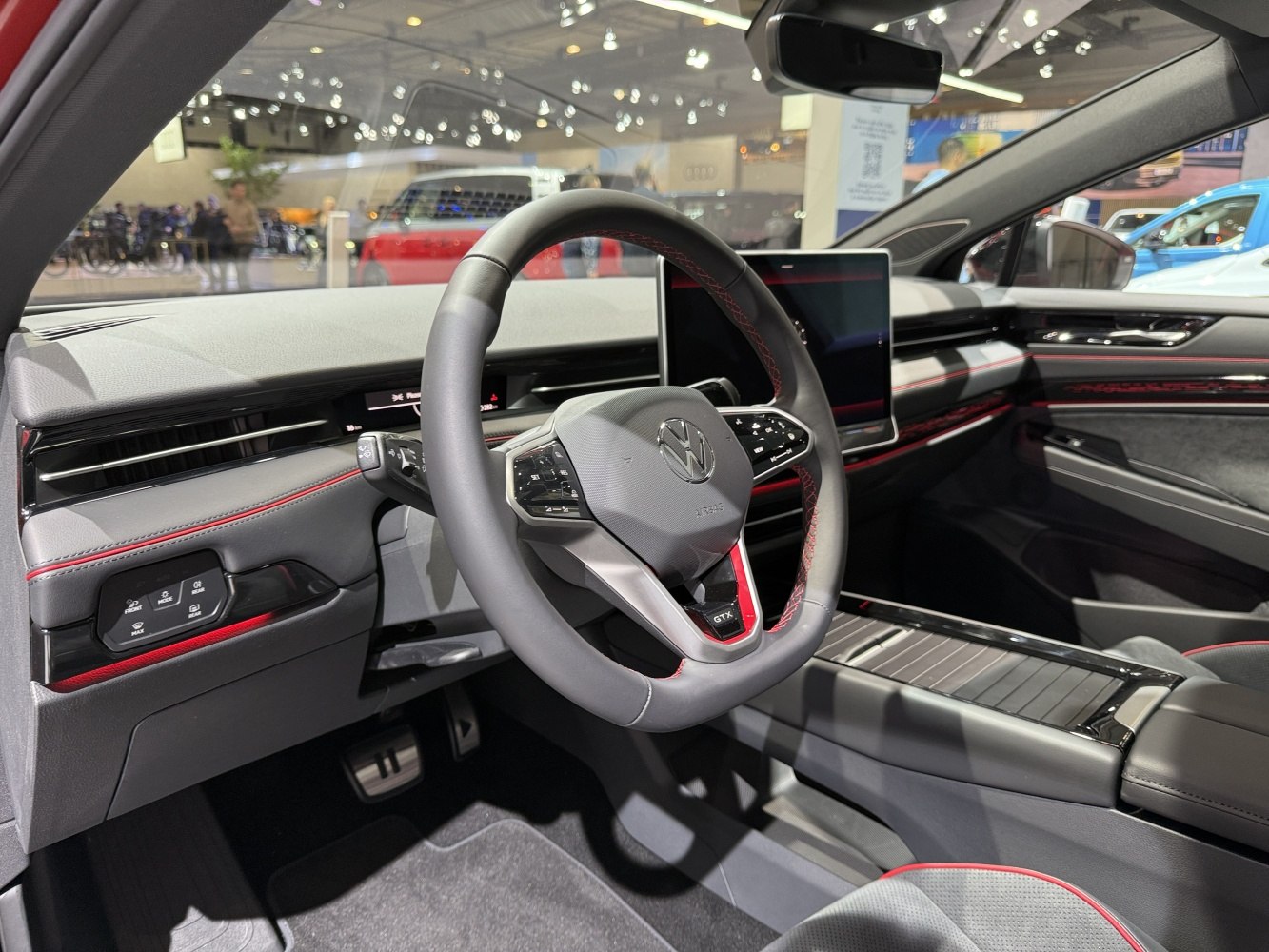 Digital multifunction steering wheel and central touchscreen display in modern car interior