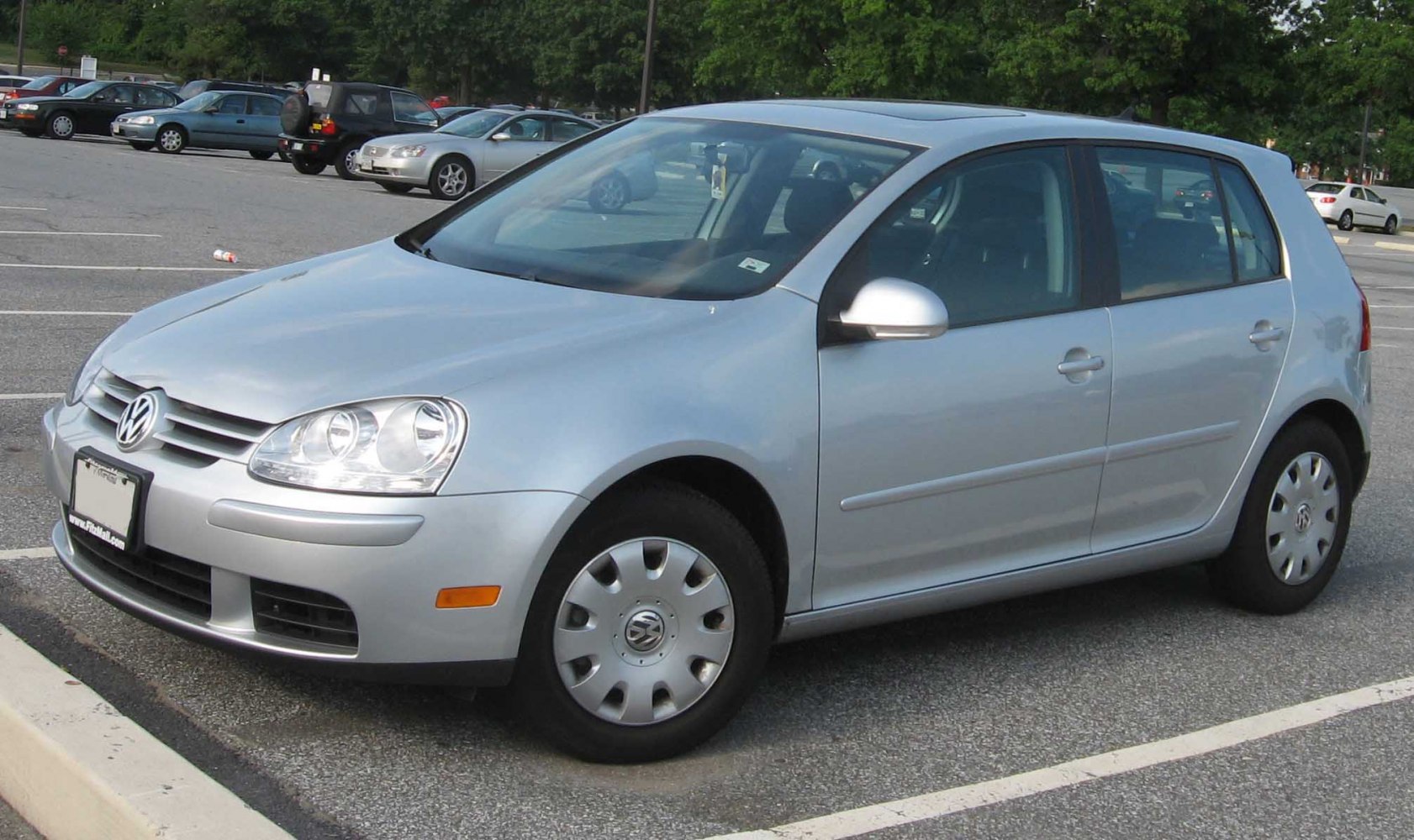 Silver 5-door hatchback with rounded headlights and compact design