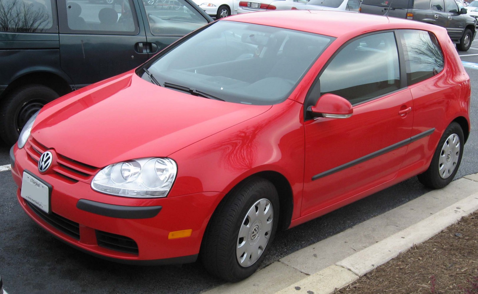 Red 3-door compact hatchback with rounded headlights and smooth body lines