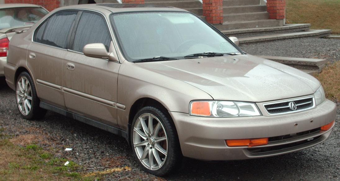 Sedan front side view showing headlights and alloy wheels
