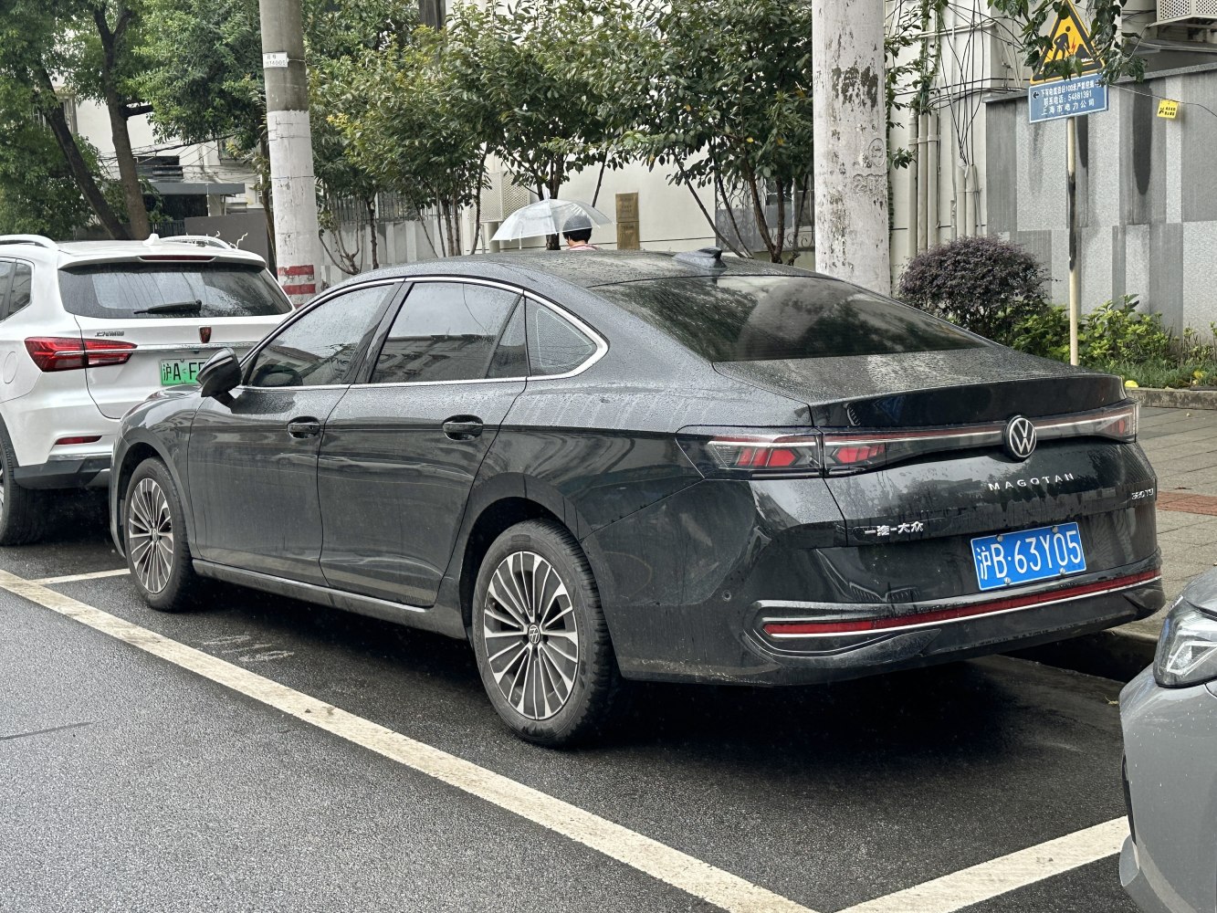 Sleek rear side of a modern sedan with stylish tail lights and alloy wheels