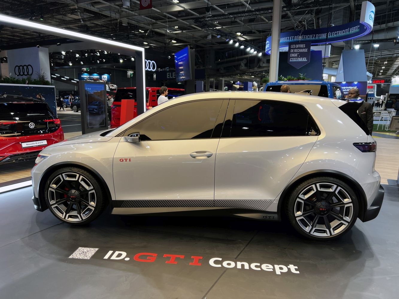 Side profile with sporty wheels and GTI badge of electric hatchback