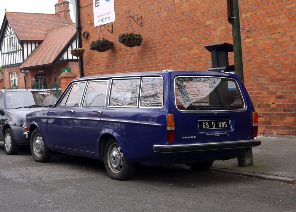 Rear view of vintage station wagon with tailgate and chrome bumper