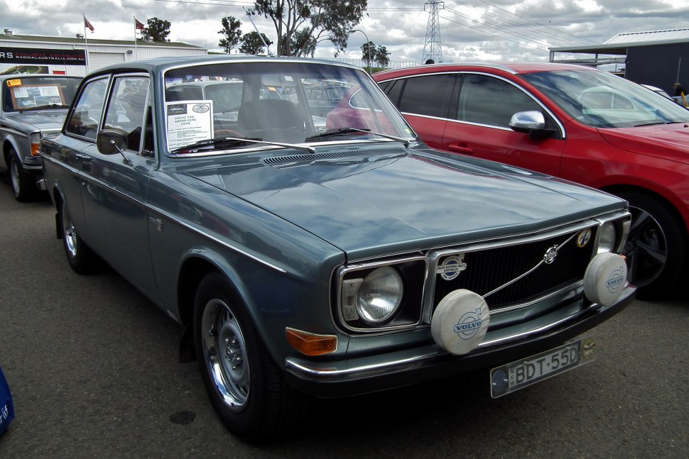 Front view of vintage sedan with round headlights and dual fog lights