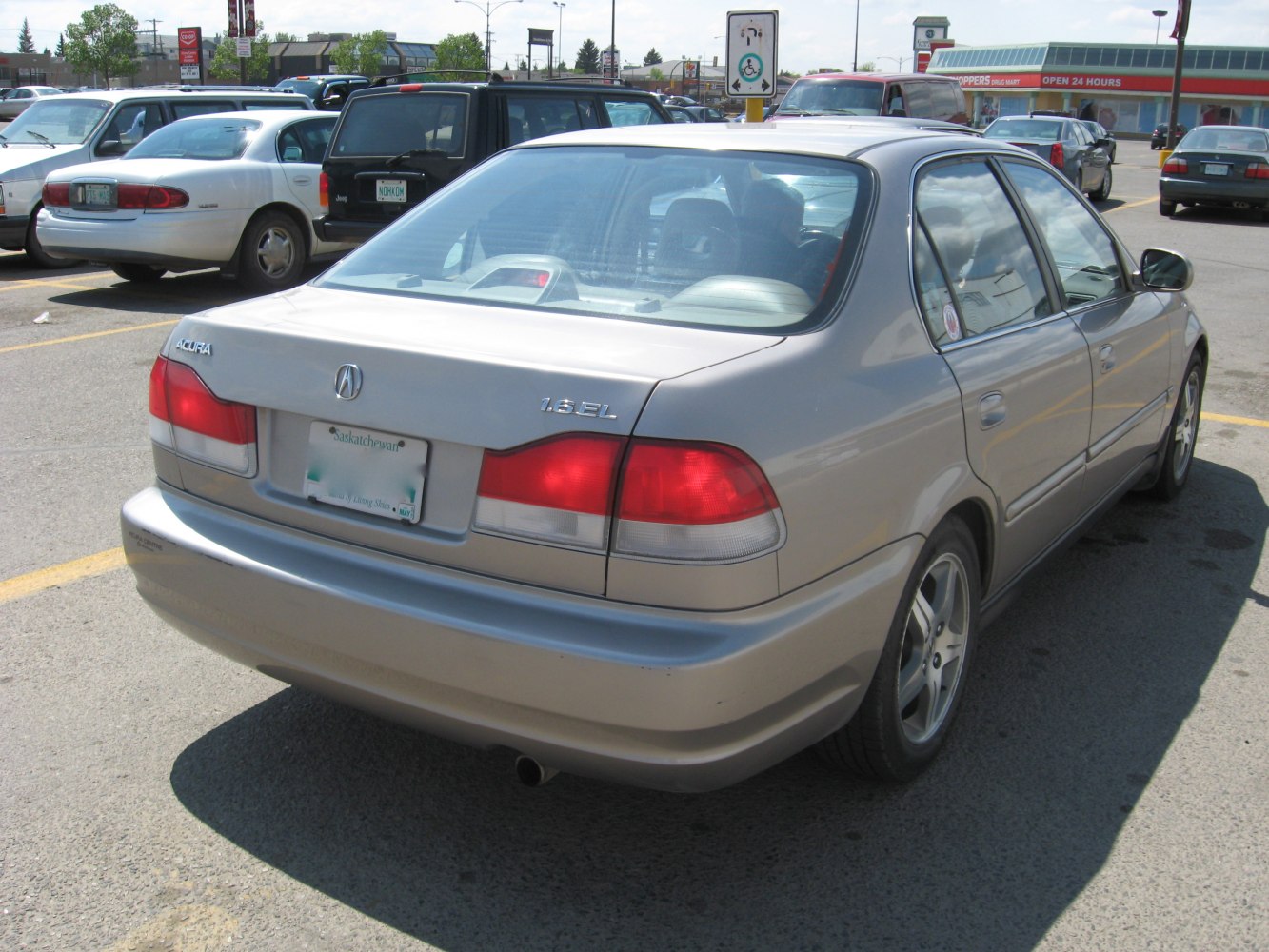Rear view of a sedan featuring taillights and model badging